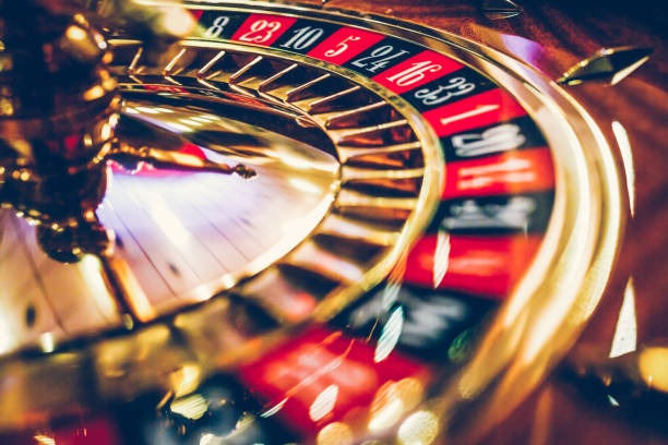 Screenshot of live roulette table interface showing wheel, betting grid, and real dealer on NetEnt platform